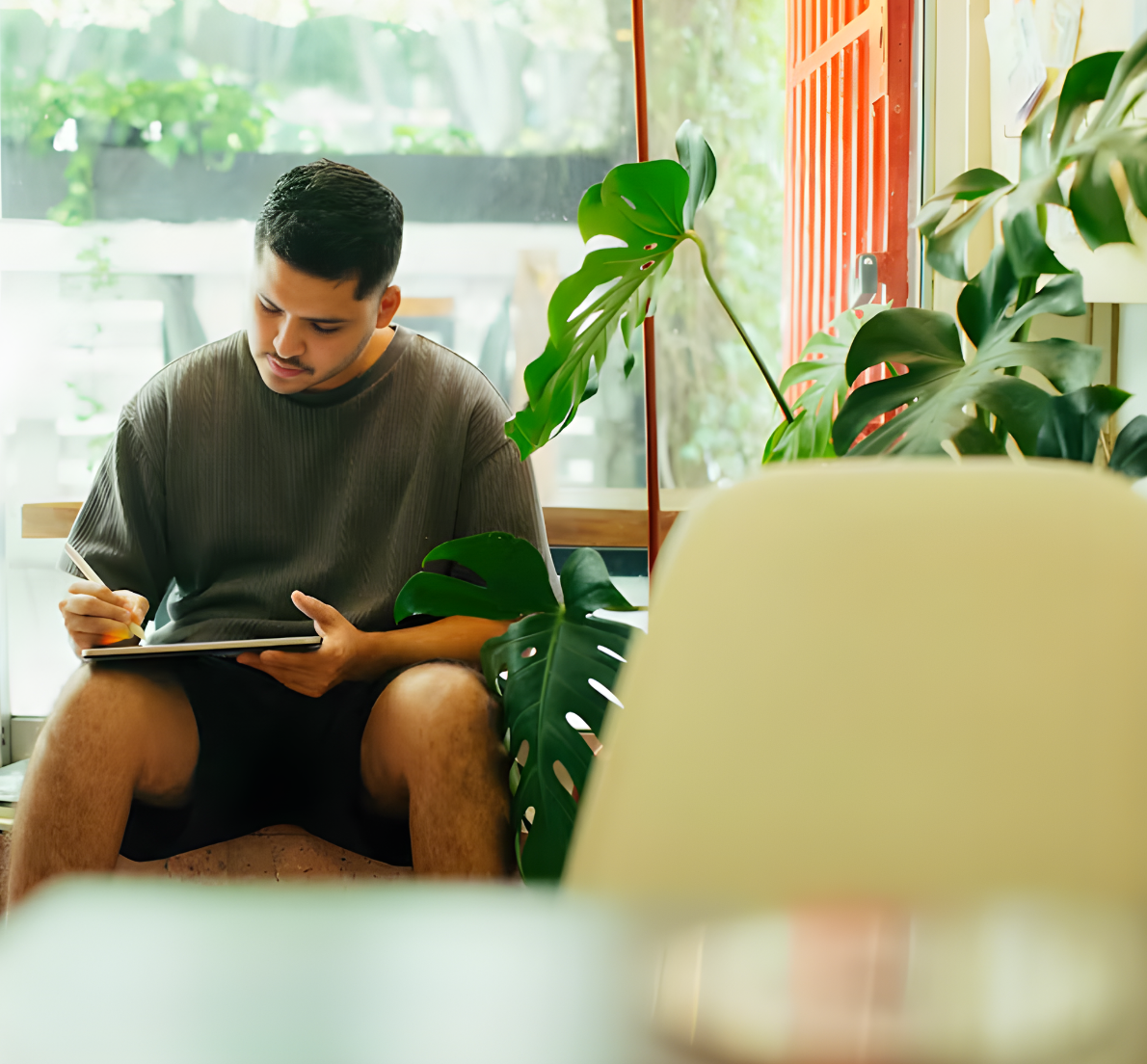 Juan, an AMS Coliving resident, working from a Lisbon coworking space