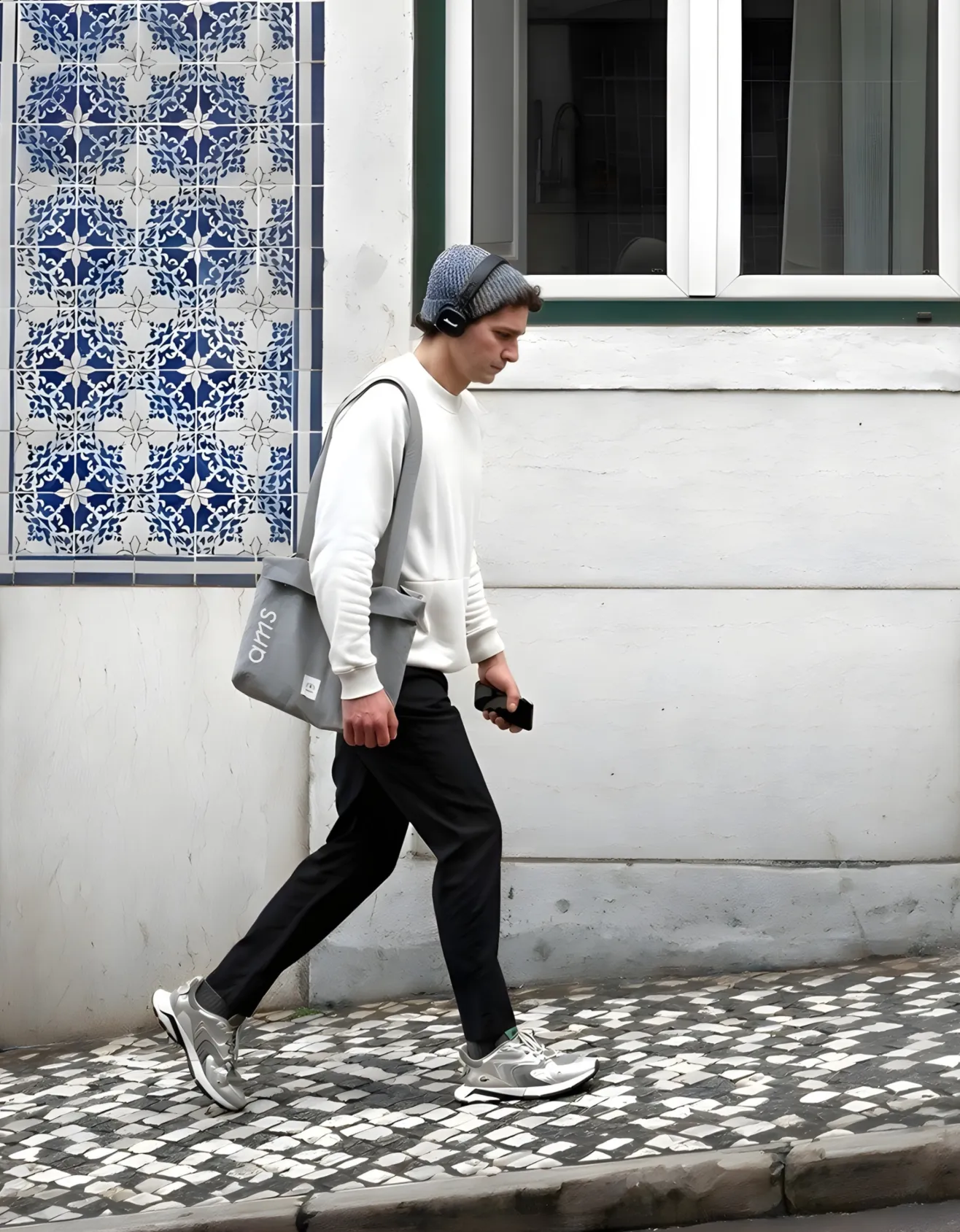 An AMS Coliving resident walking through Lisbon